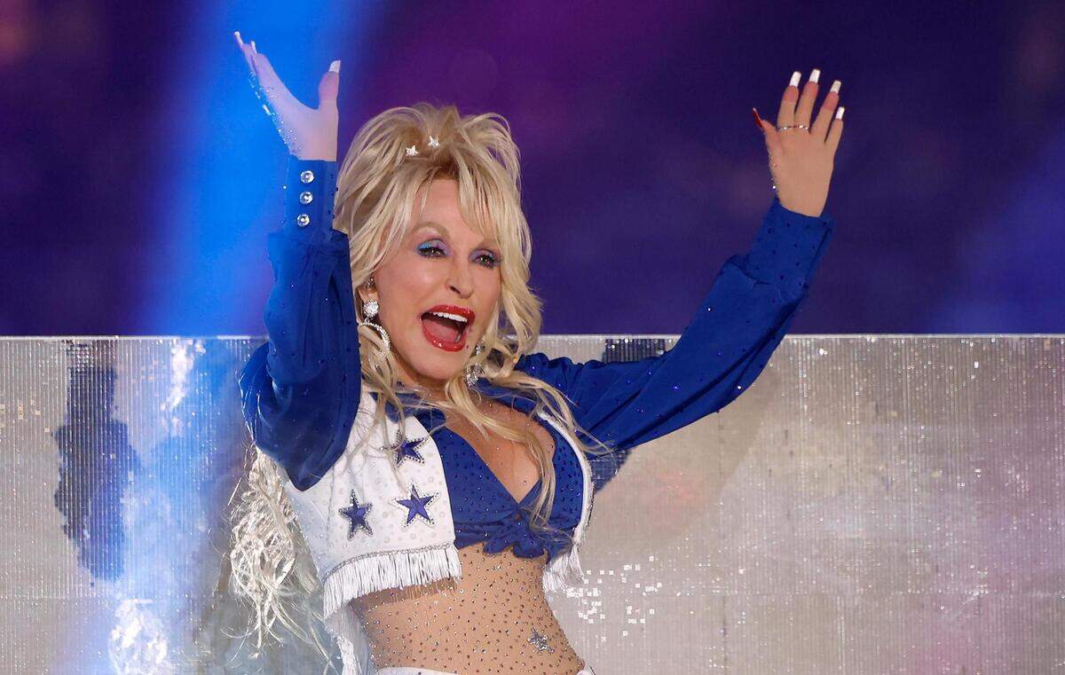 Dolly Parton performs during the Dallas Cowboys’ halftime show to kickoff the Red Kettle Campaign on Thursday, November 23, 2023, at AT&T Stadium in Arlington.